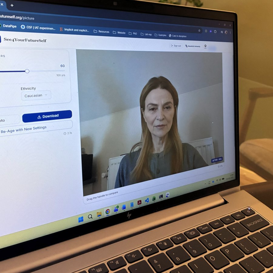 Laptop screen showing a portrait aged to 60 by the See4YourFutureSelf tool